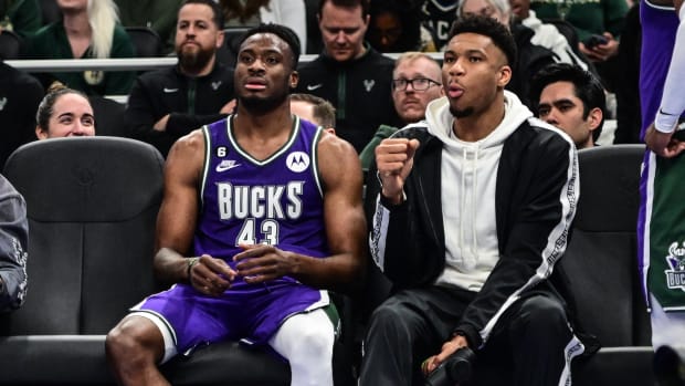 Apr 7, 2023; Milwaukee, Wisconsin, USA; Milwaukee Bucks forward Giannis Antetokounmpo sits with his brother forward Thanasis Antetokounmpo
